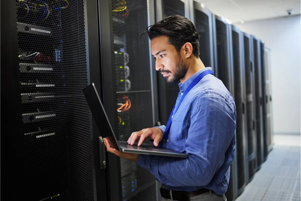 Cybersecurity professional monitoring server infrastructure and network systems in a secure data center environment