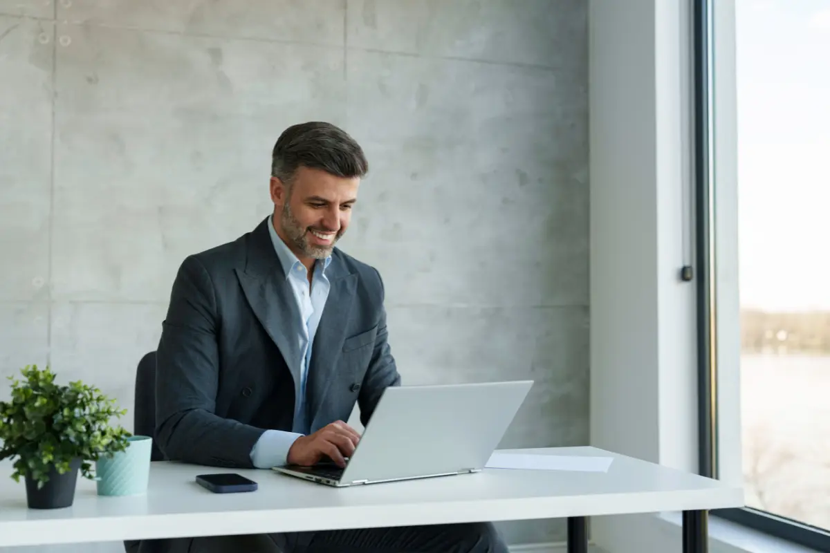 Business owner completing annual business filings and corporate filings online to maintain annual compliance and avoid business penalties for late LLC filings.