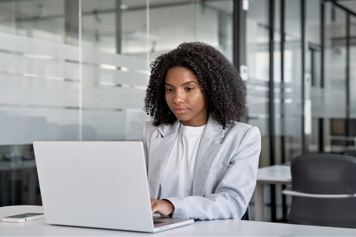 Business professional completing business amendment filing process online for LLC amendment form and corporation updates