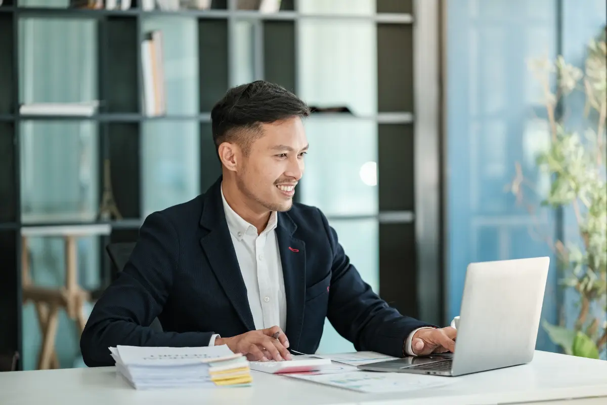 Business owner managing business and personal assets separation documentation for liability protection and asset security planning.