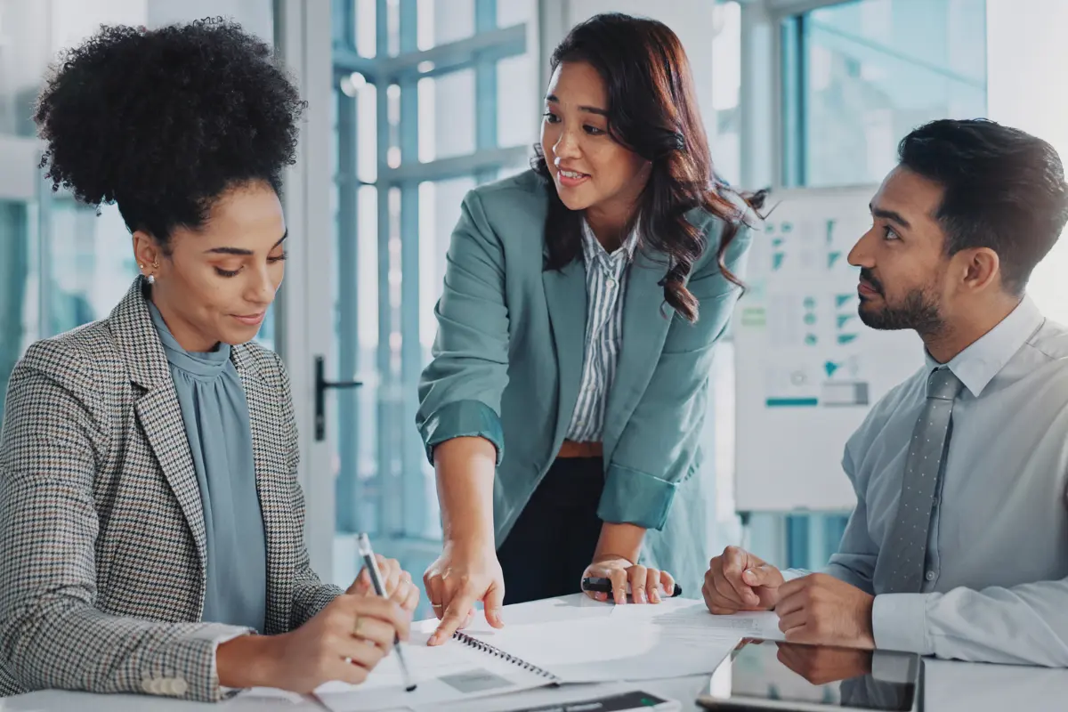 Business team reviewing business documents to correct business filing errors and amend business documents together
