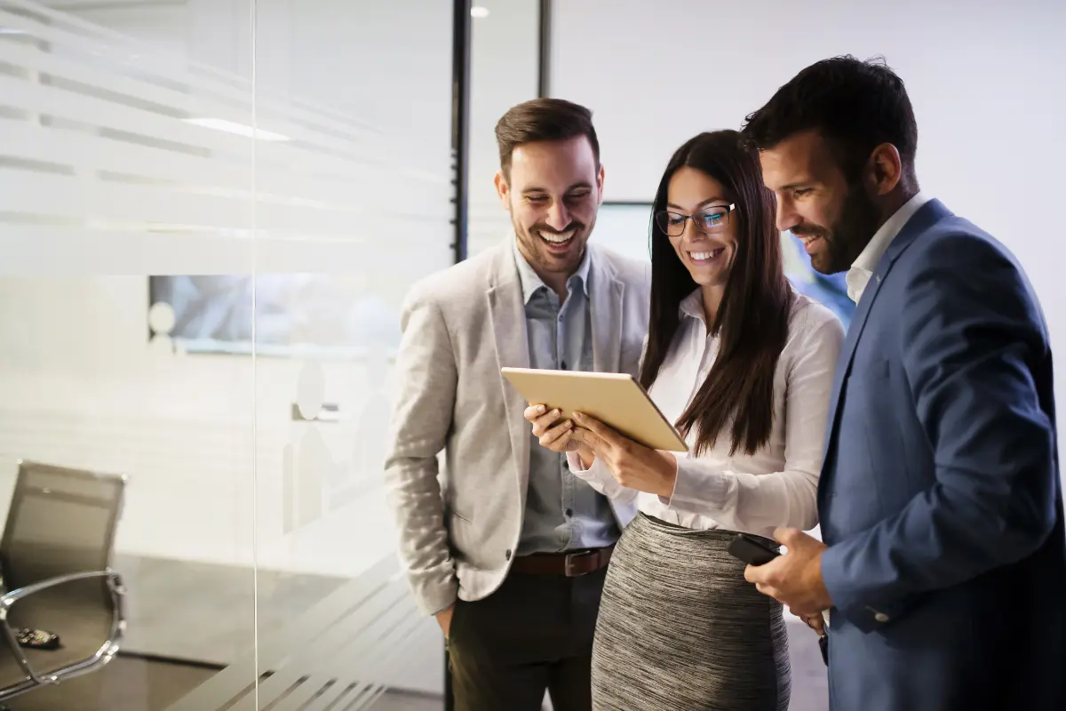 LLC owners reviewing business valuation and buy-sell agreement options on tablet when planning an LLC exit strategy and ownership transfer
