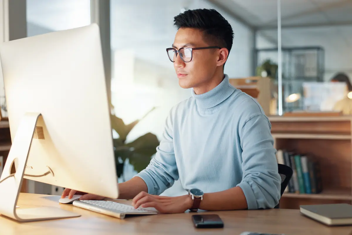 New entrepreneur learning common business terms for entrepreneurs and business terminology for startups while working at home office desk.