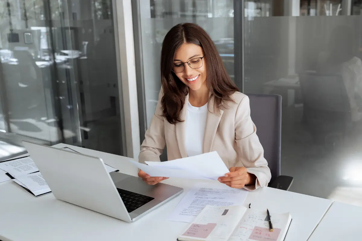 Business owner reviewing certified articles of organization and LLC formation documents received from the secretary of state as a certified copy