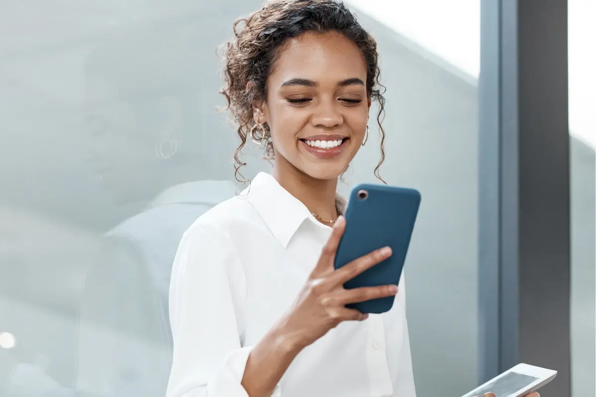 LLC business owner filing copyright registration online to protect digital content and creative works for her company using a mobile device.