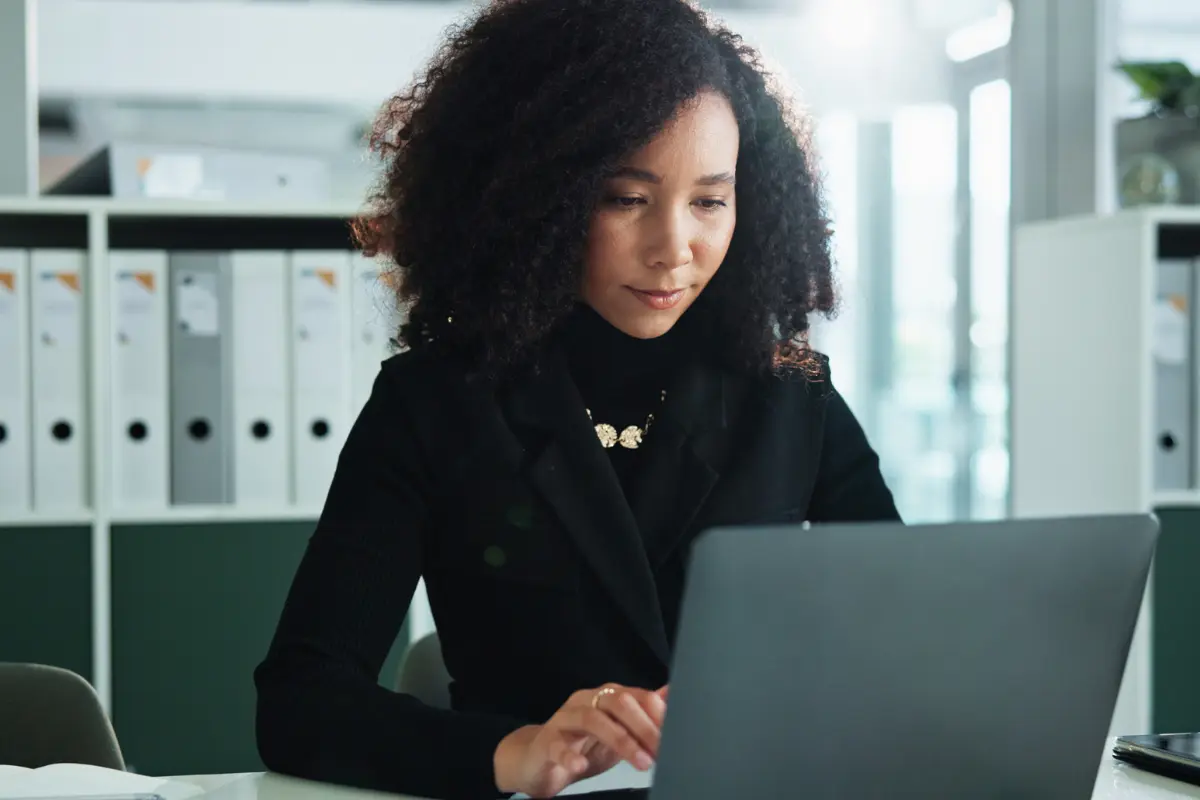 Business professional working to maintain business compliance and avoid loss of good standing with state filing requirements