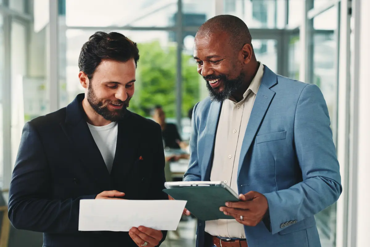 New business owners reviewing LLC benefits and advantages of forming an LLC over a sole proprietorship for liability protection and operating flexibility