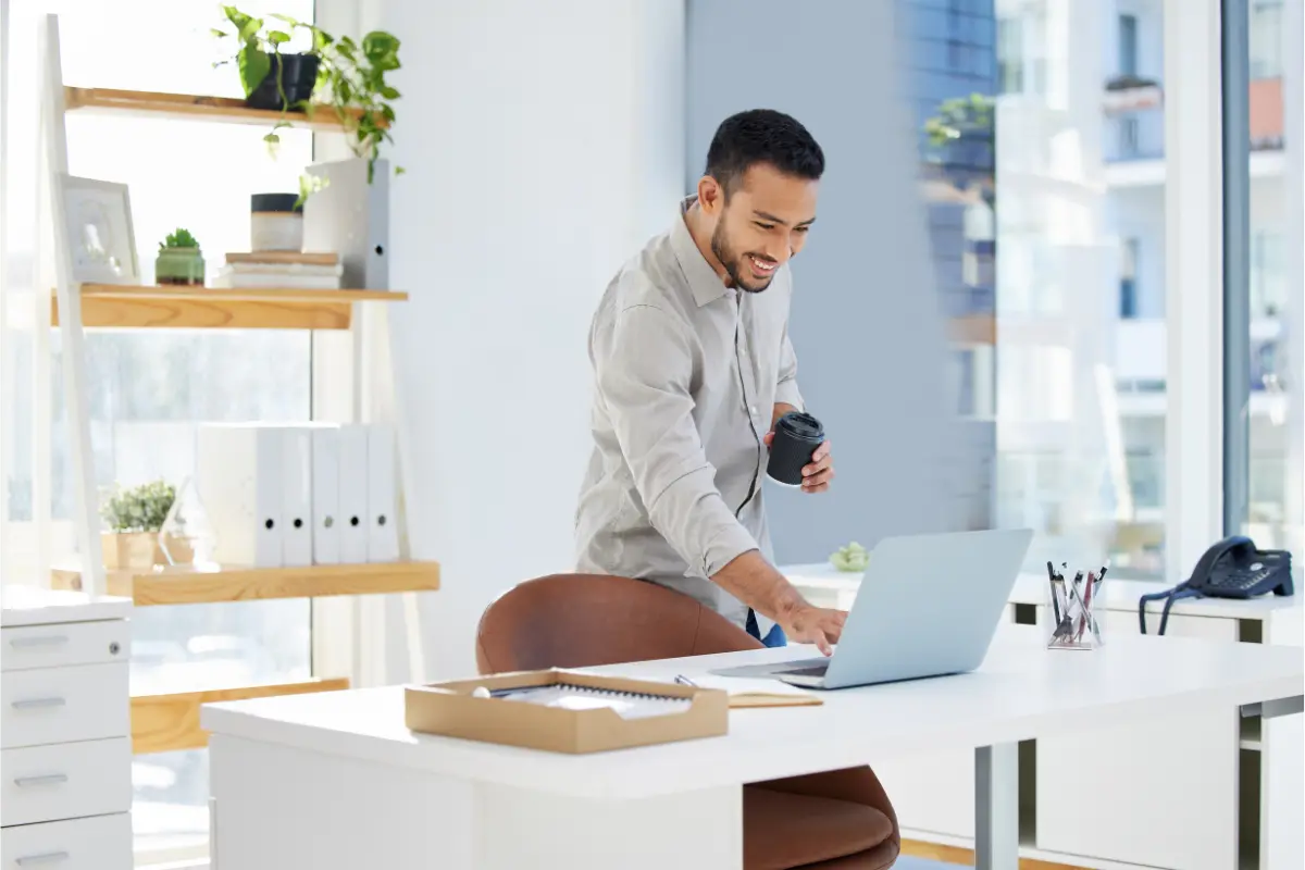 Small business owner researching LLC vs sole proprietorship taxes and best business structure for small business on laptop