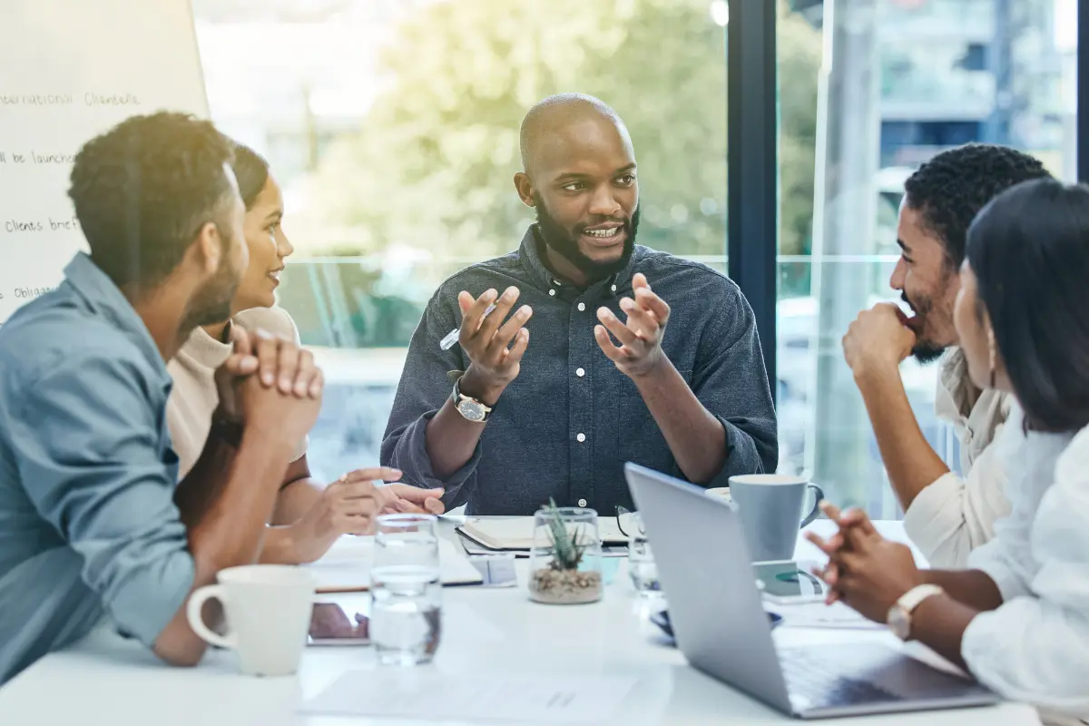 Business team discussing legal entity management and corporate compliance strategies in modern office.