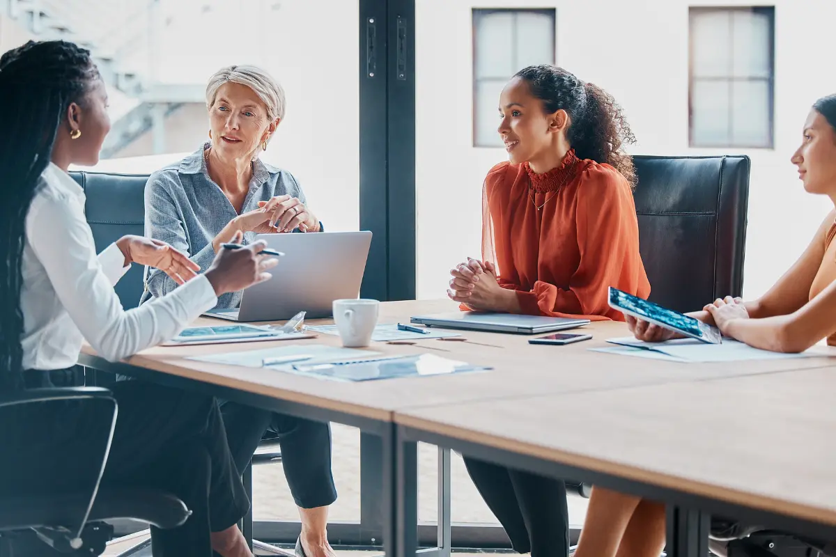 Multi-member LLC partners meeting to discuss operating agreement and business growth strategy