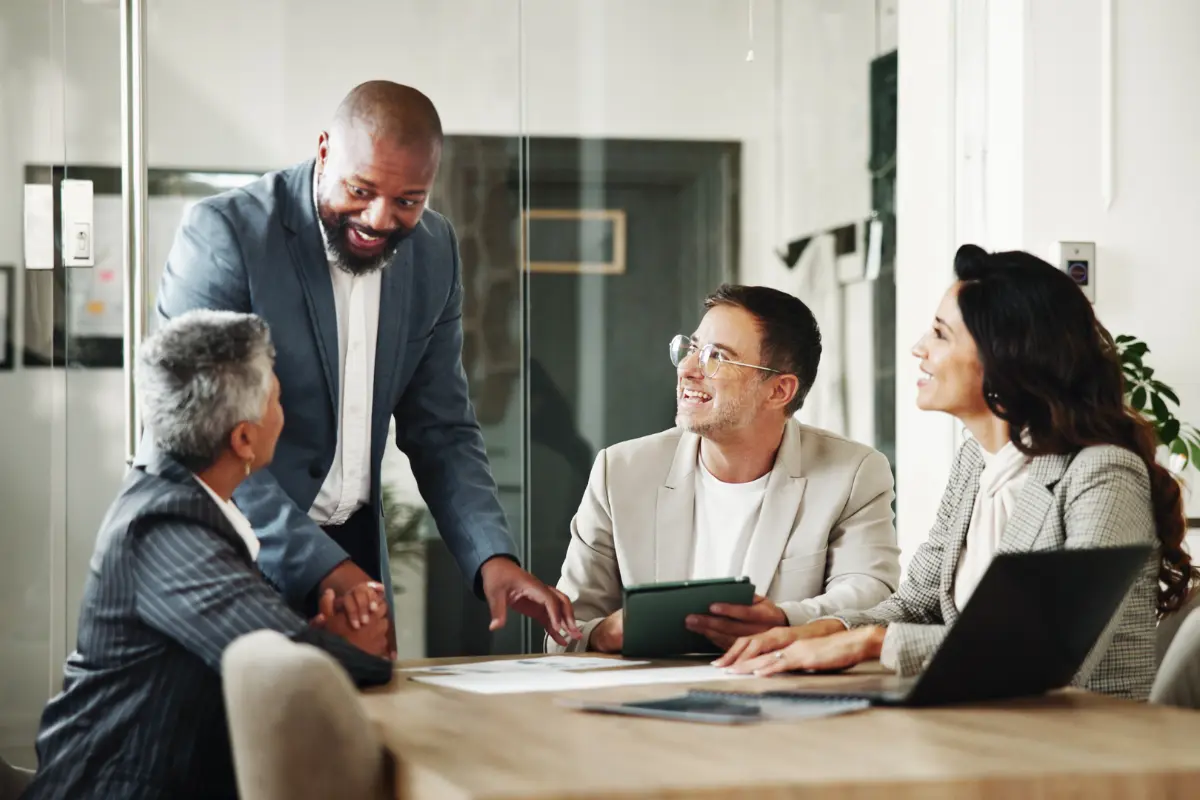 Business team meeting to evaluate formation provider options and entity management solutions for company growth.