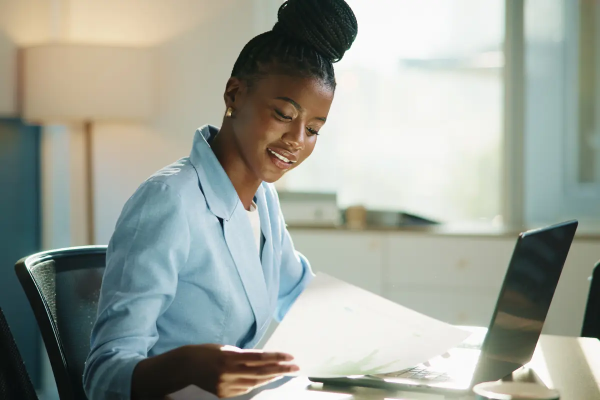 Business owner working on business closure paperwork and compliance requirements for dissolving company and handling legal obligations.
