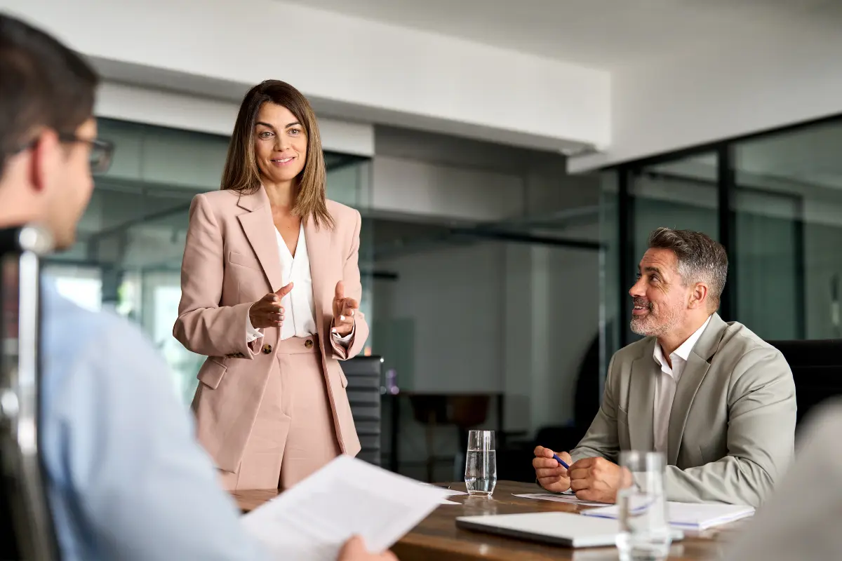 Business professionals discussing international document authentication and apostille requirements for cross-border contracts and business registration in foreign countries