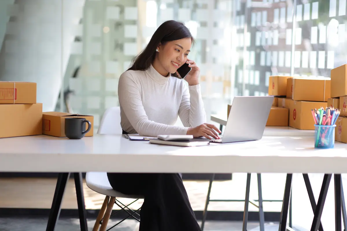 Small business owner managing operations while using professional registered agent service for legal documents.