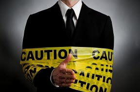 businessman ties with caution tape