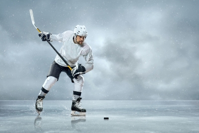 olympic athlete playing hockey